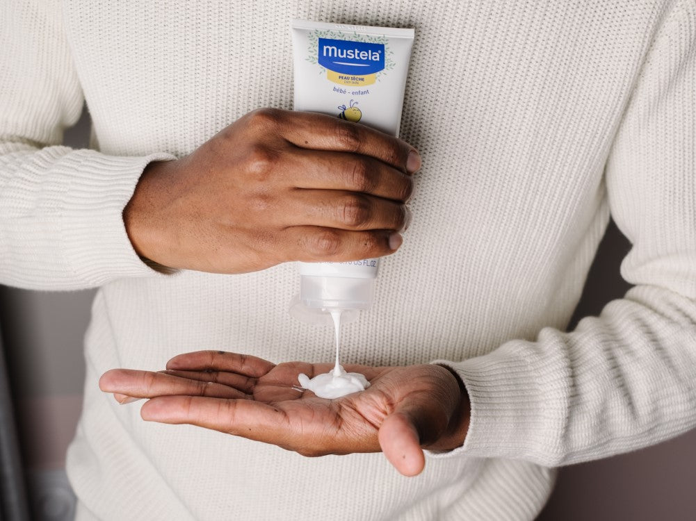 Mustela Cold Cream, lotion squeezed from the tube into a palm