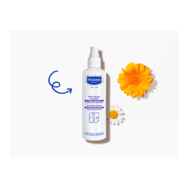 Mustela Diaper Rash Spray, spray bottle beside calendula and chamomile flowers