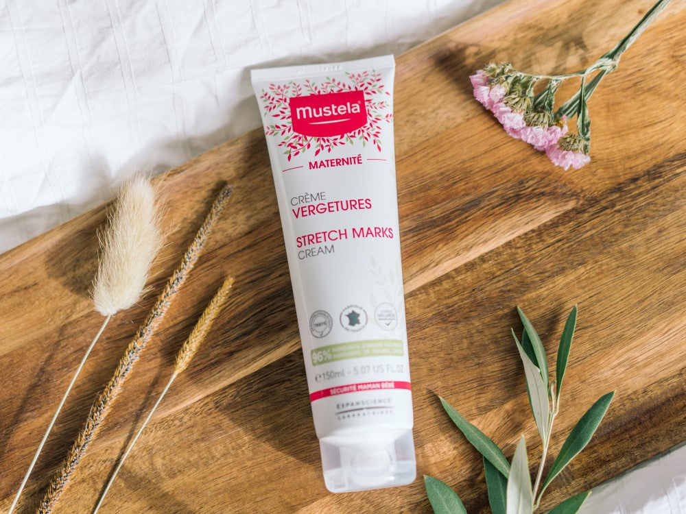 Mustela Maternity, tube on a wooden board with dried grasses