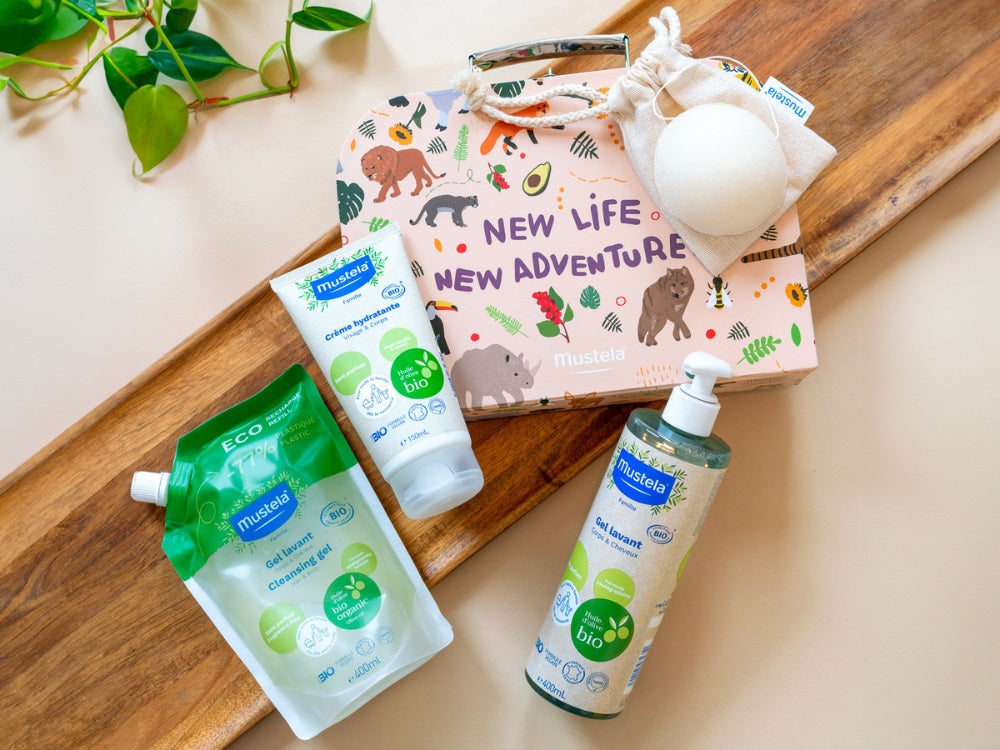 Mustela Organic Body and Hair Wash, refill pouch, cream tube and pump bottle with a gift box