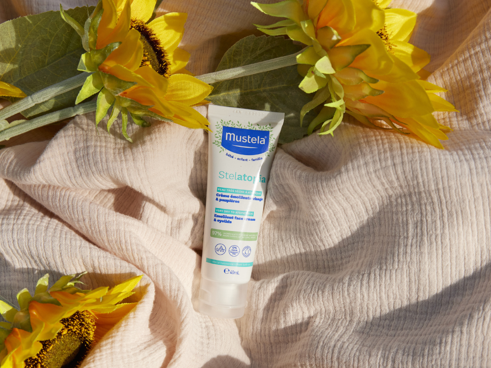 Mustela Stelatopia, tube on muslin fabric with sunflowers