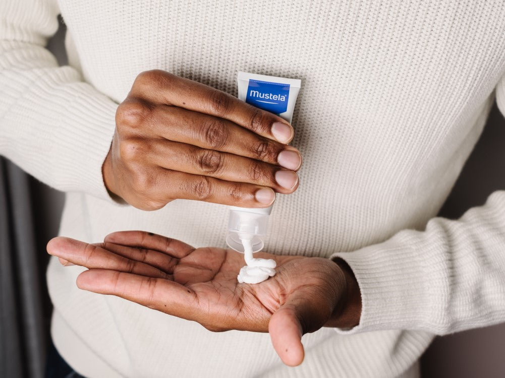 Mustela Stelatopia, cream squeezed from the tube into a palm