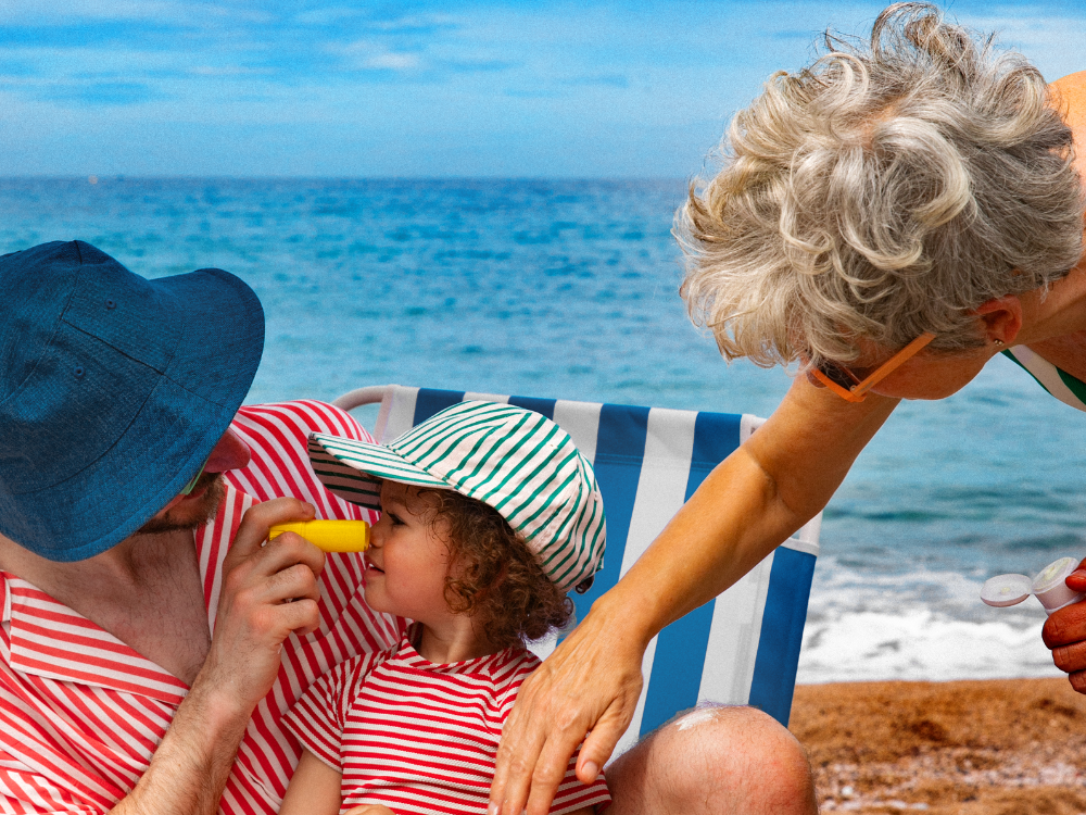 Mustela Sun Stick, adult applying the stick to a child's nose at the beach