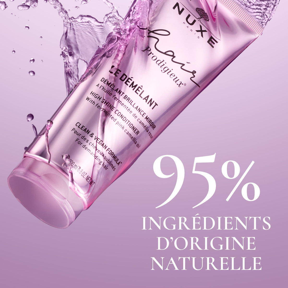 NUXE Hair Prodigieux, tube in a pink water splash, text in French