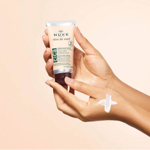 NUXE Honey Hand Cream, applied to the hands
