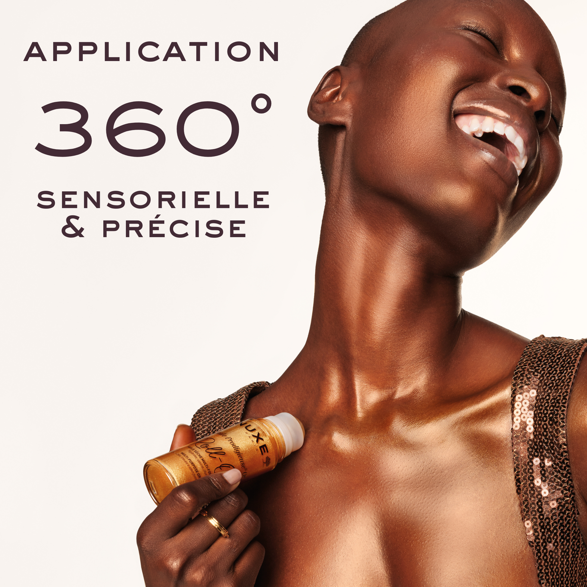 NUXE Huile Prodigieuse Gold Roll-On, applied to the body, text in French