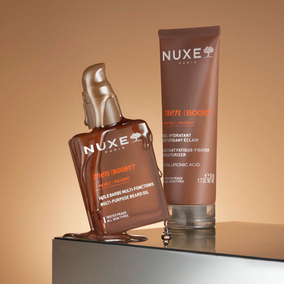 NUXE Men Boost, pump bottle beside the moisturizing gel tube