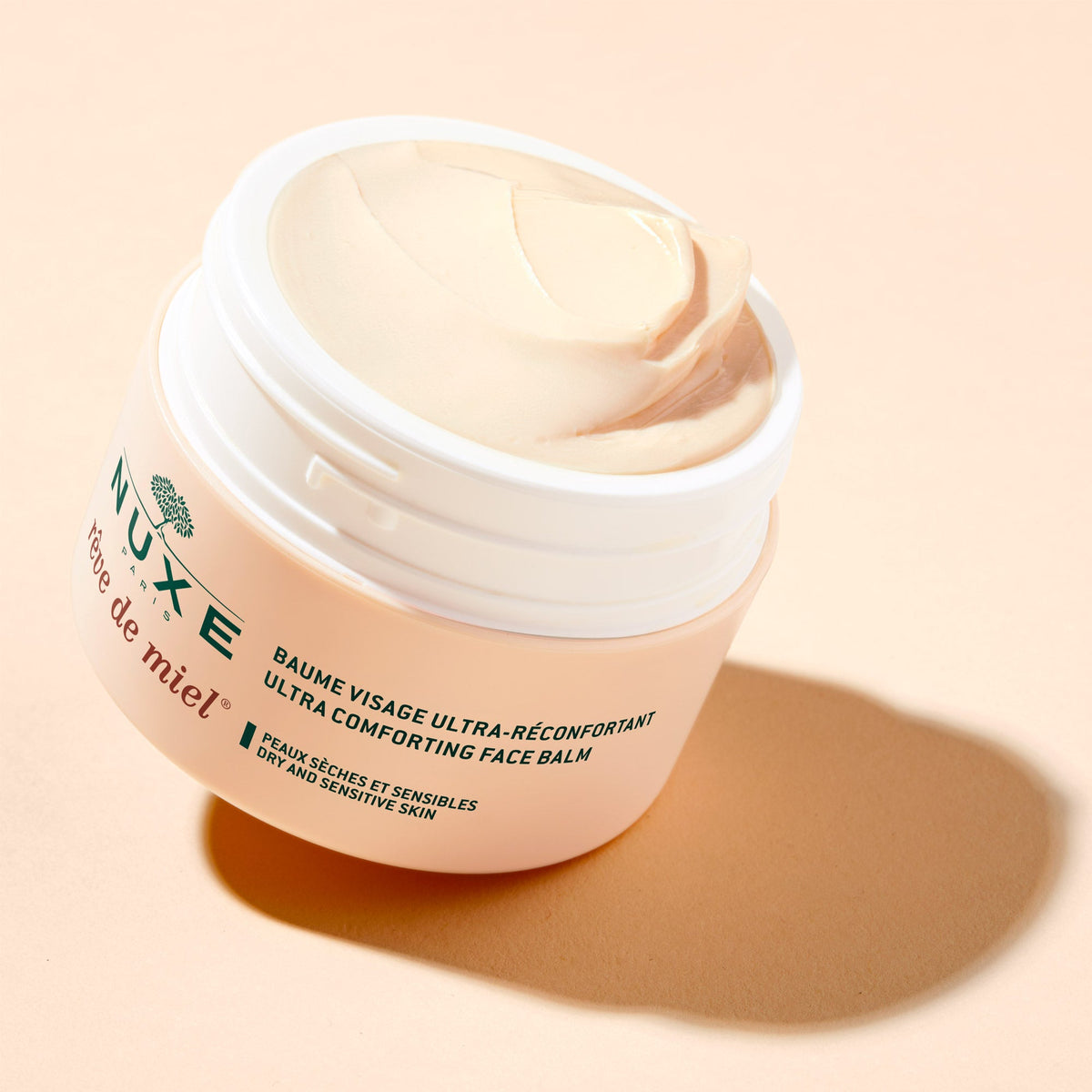 NUXE Rêve de Miel, open jar showing the balm