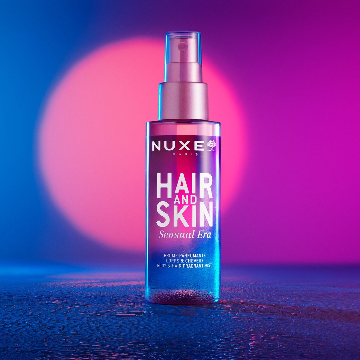 NUXE Hair and Skin Sensual Era, spray bottle under pink and blue light