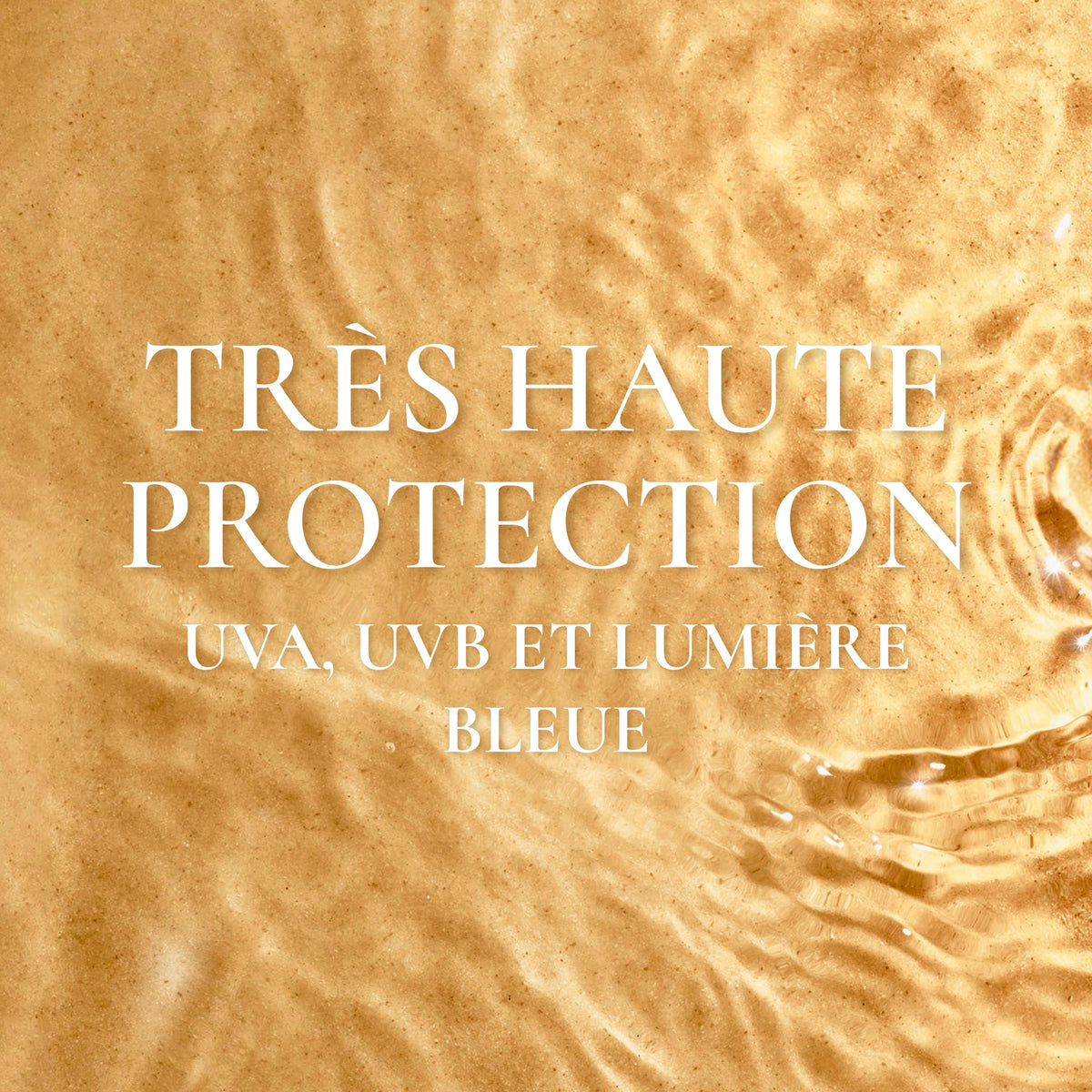 NUXE SUN, shallow water over golden sand, text in French