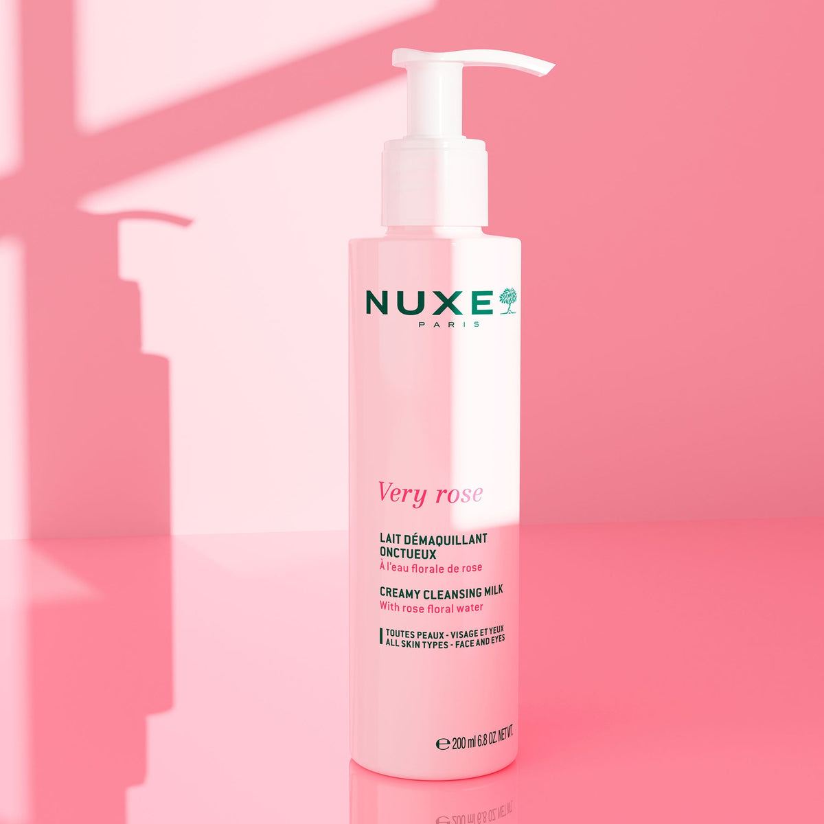 NUXE Very Rose, pump bottle on a pink background with soft shadows