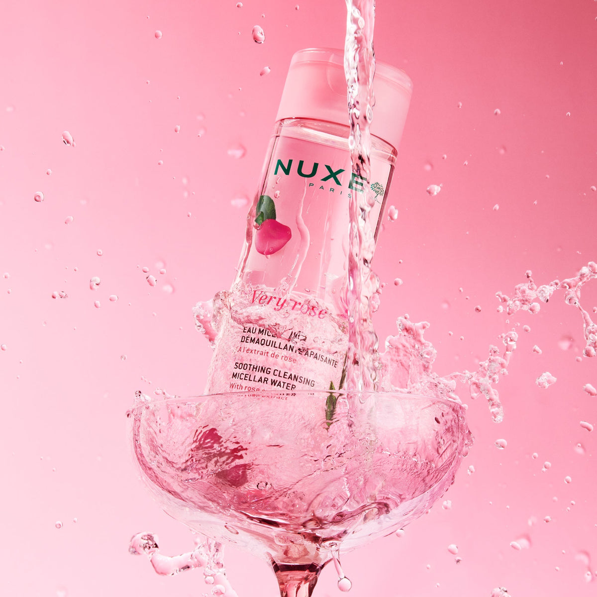 NUXE Very Rose, bottle in a coupe glass with splashing water