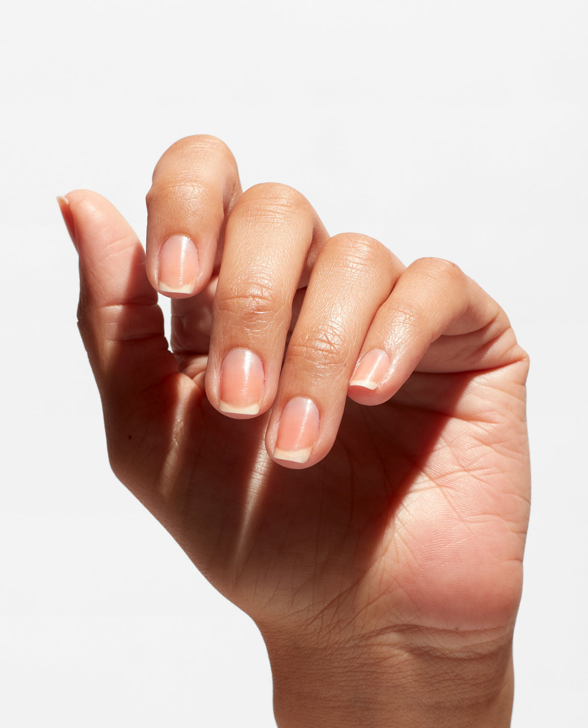 OPI Natural Nail Base Coat, applied to the hands