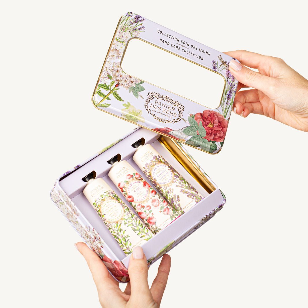 Panier des Sens, hands opening the metal gift tin with three hand creams
