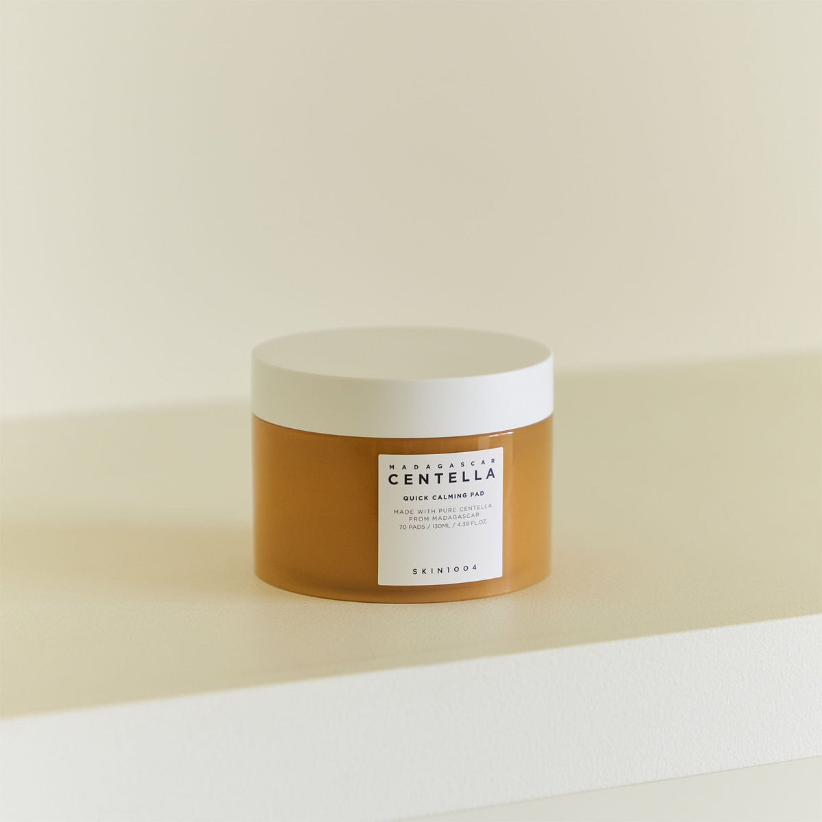 SKIN1004 Madagascar Centella, jar on a cream-colored step