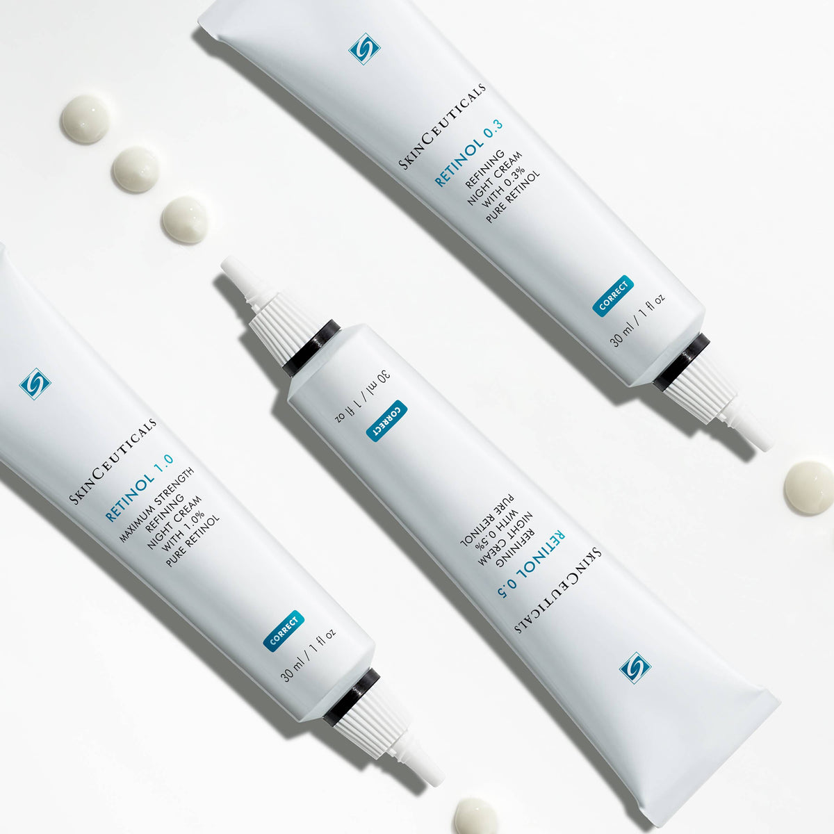 SkinCeuticals Retinol 0.3, tubes of Retinol 0.3, 0.5 and 1.0 with cream dots