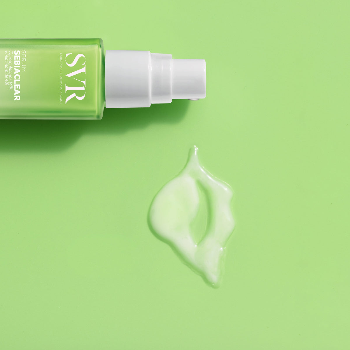 SVR Sebiaclear, pump bottle and serum swatch on a green background
