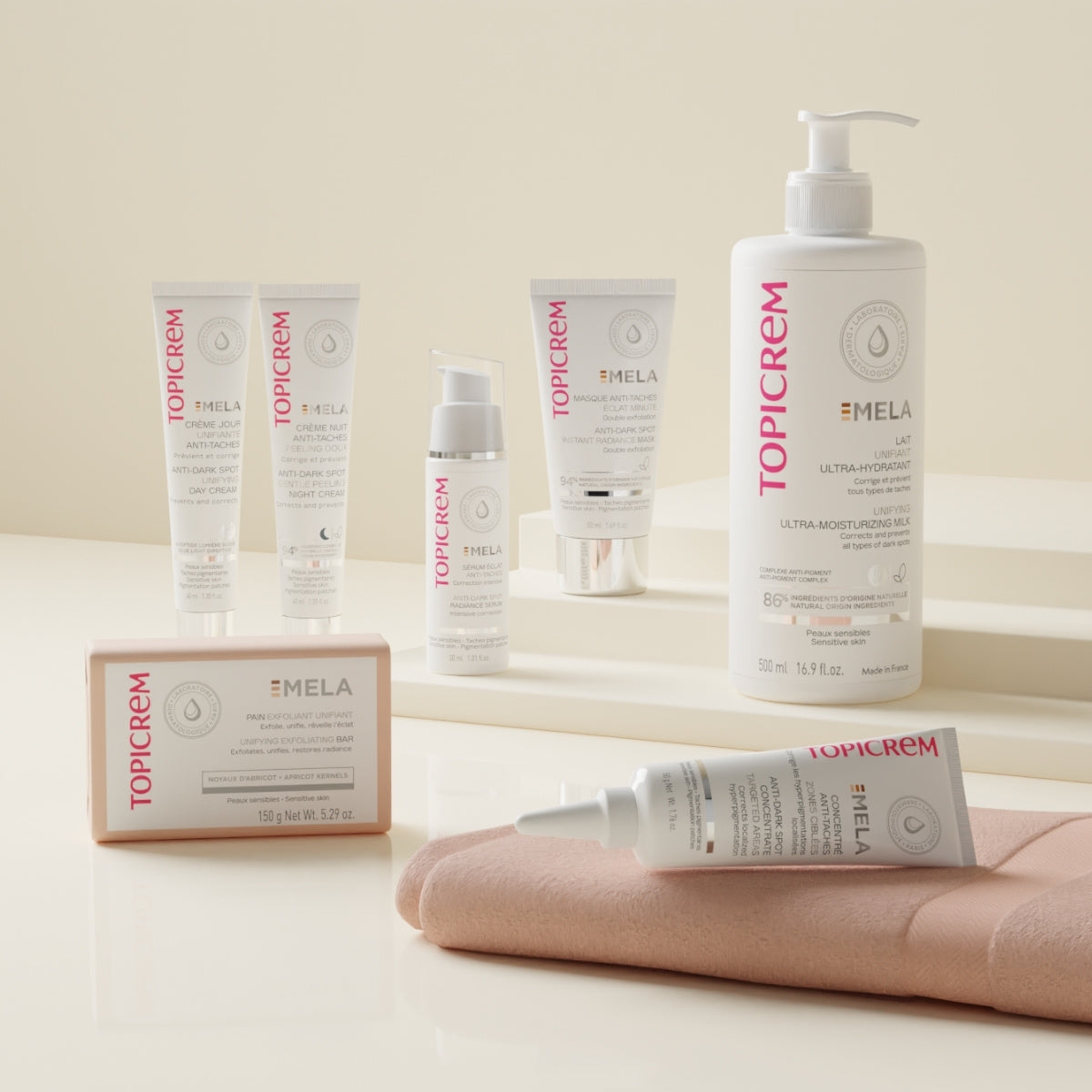 Topicrem MELA, range of tubes, serum, pump bottle and boxed bar