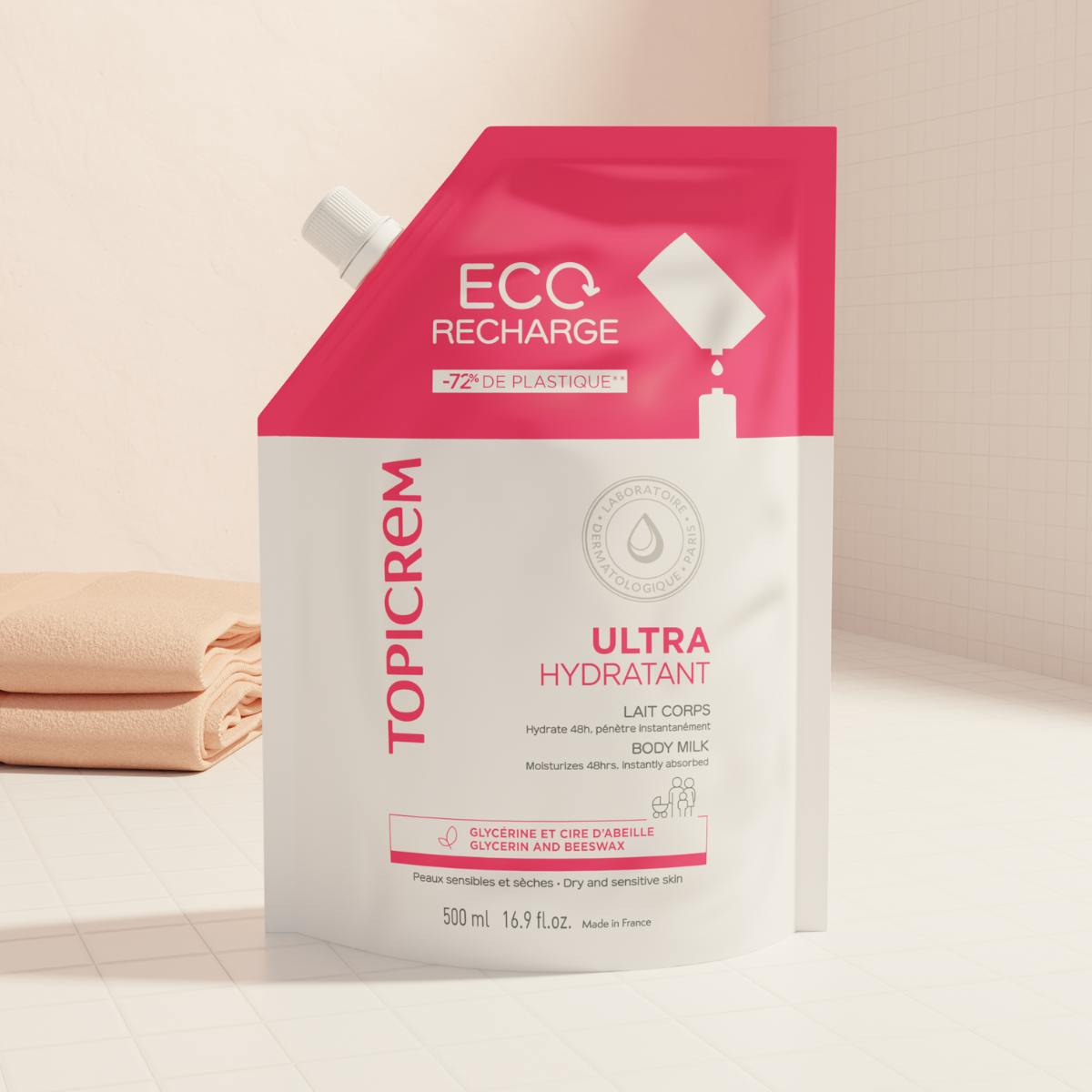 Topicrem Ultra Hydrating 500ml, refill pouch in a bathroom with towels