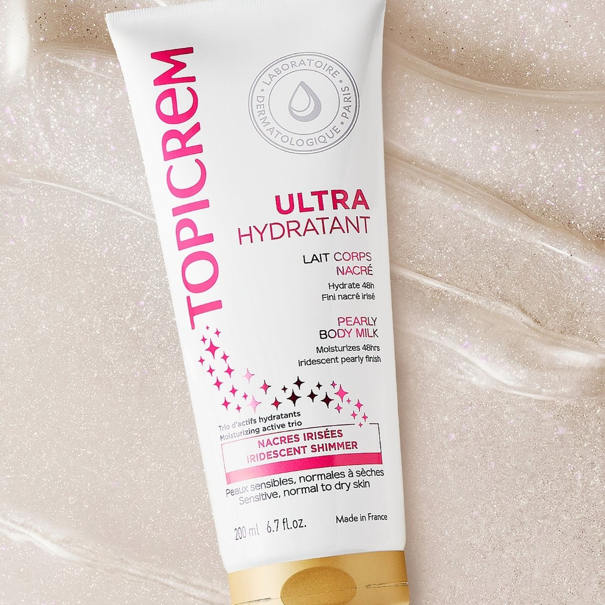 Topicrem Ultra Hydratant 200ml, tube on a bed of shimmering milk