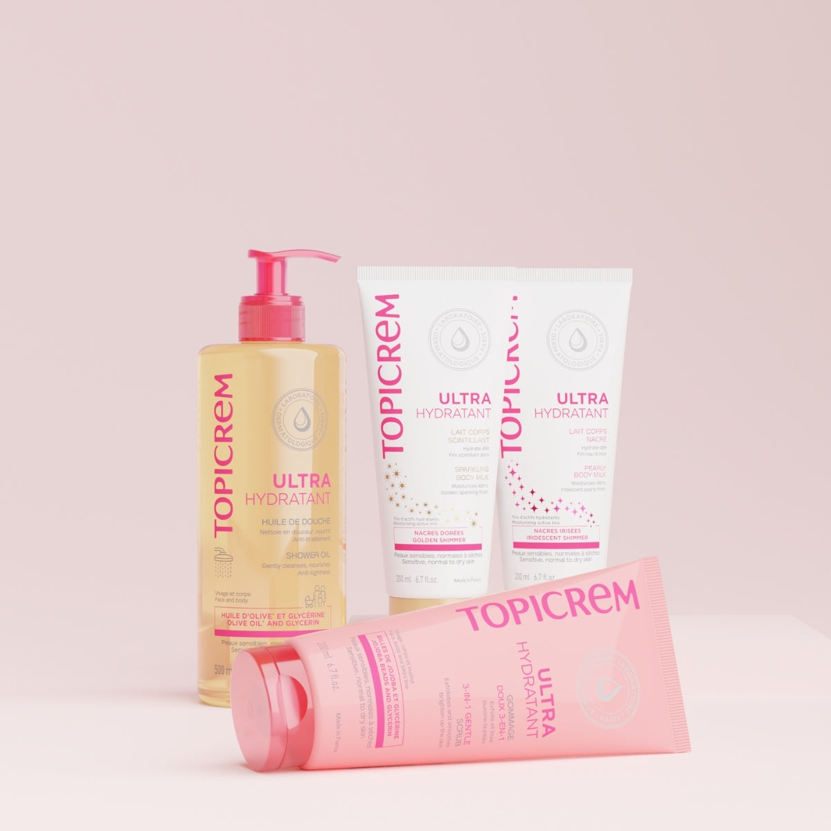 Topicrem Ultra Hydratant, shower oil, two body milk tubes and a pink tube