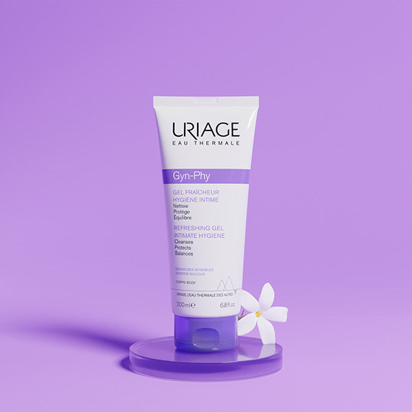 Uriage Gyn-Phy 200ml, tube on a glass stand with a white flower