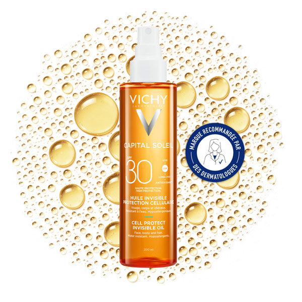 Vichy Capital Soleil, spray bottle on a bed of oil droplets