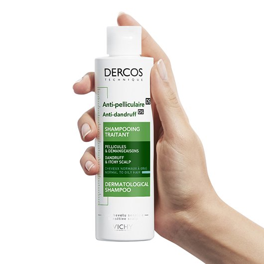 Vichy Dercos DS, hand holding the bottle