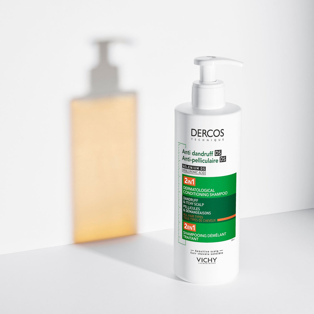 Vichy Dercos DS, pump bottle with a glowing amber silhouette behind