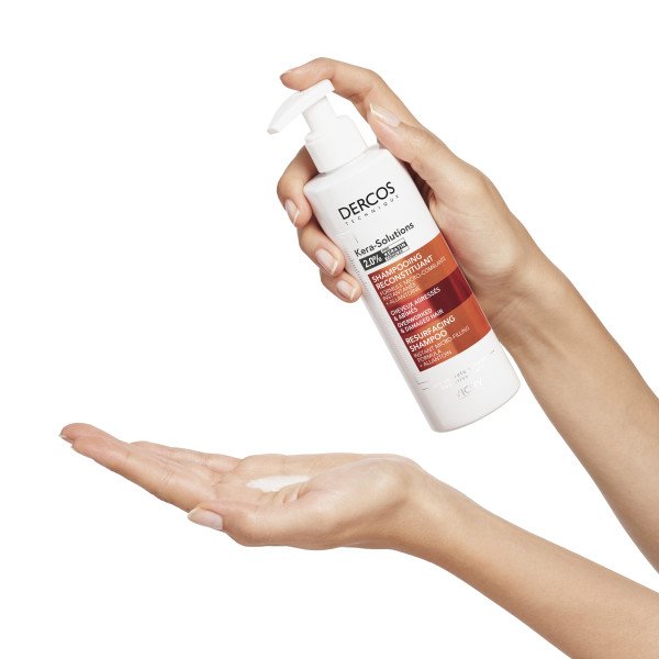 Vichy Dercos Kera-Solutions, shampoo poured from the pump bottle into a palm