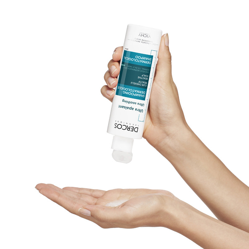 Vichy Dercos Ultra-Apaisant, shampoo poured from the bottle into a palm