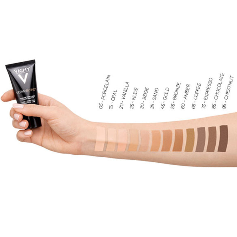 Vichy Dermablend, hand holding a tube above shade swatches on a forearm