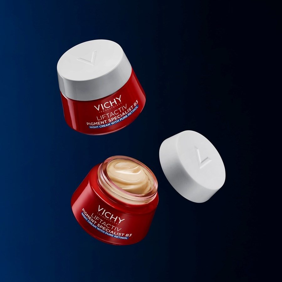 Vichy Liftactiv B3, two floating jars, one open with its lid beside it