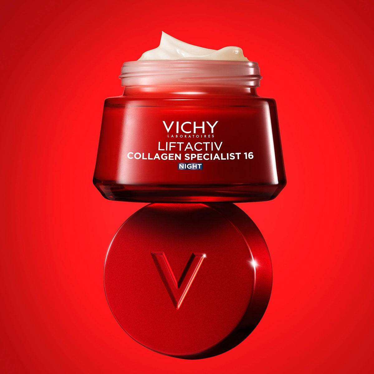 Vichy Liftactiv Collagen Specialist, open jar resting on its lid on a red background