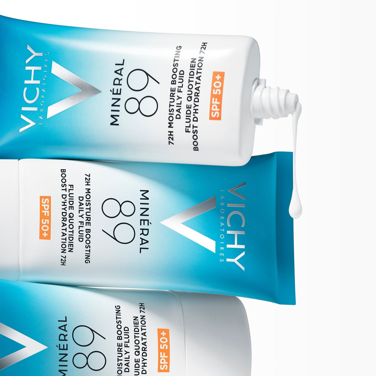 Vichy Mineral 89, three stacked tubes, the top one open with fluid dripping