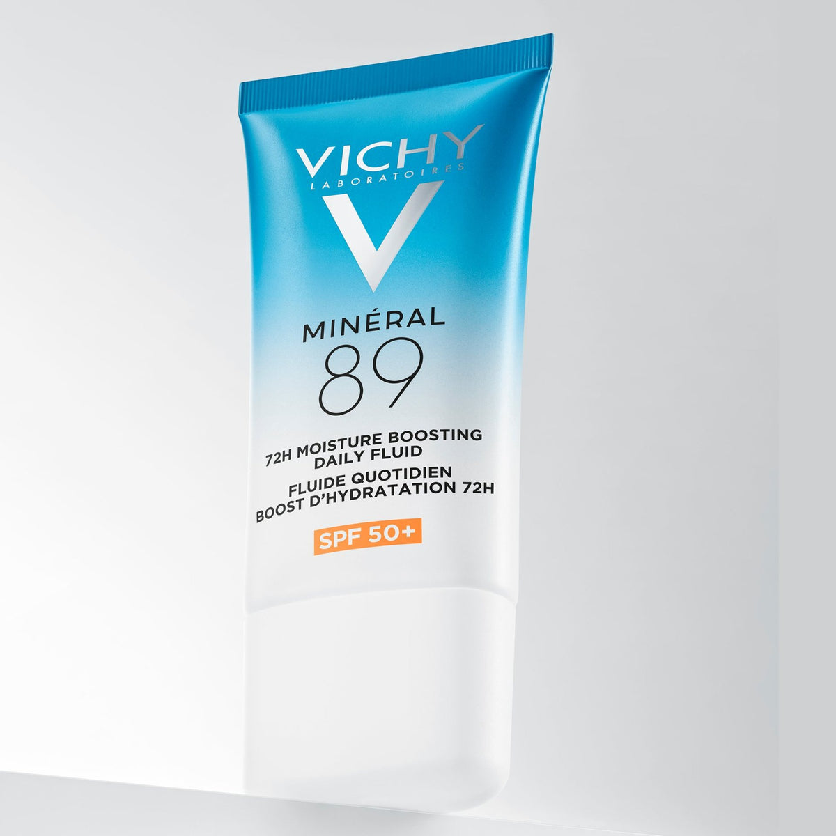 Vichy Mineral 89, front of the tube, tilted on a white step