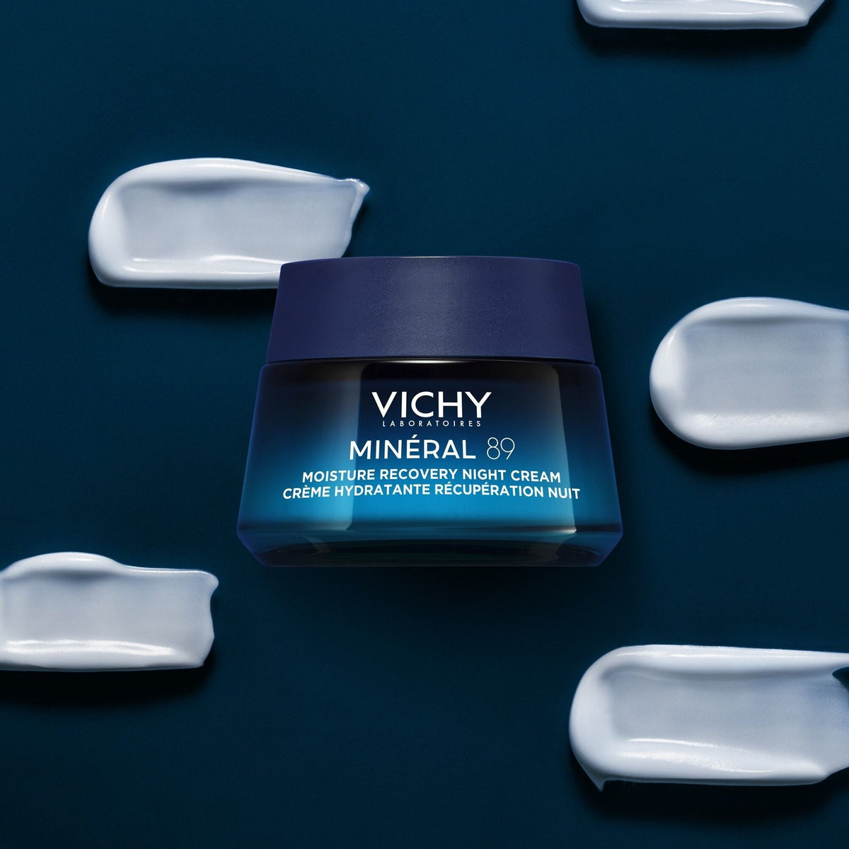 Vichy Minéral 89, jar surrounded by cream swatches on a dark blue background
