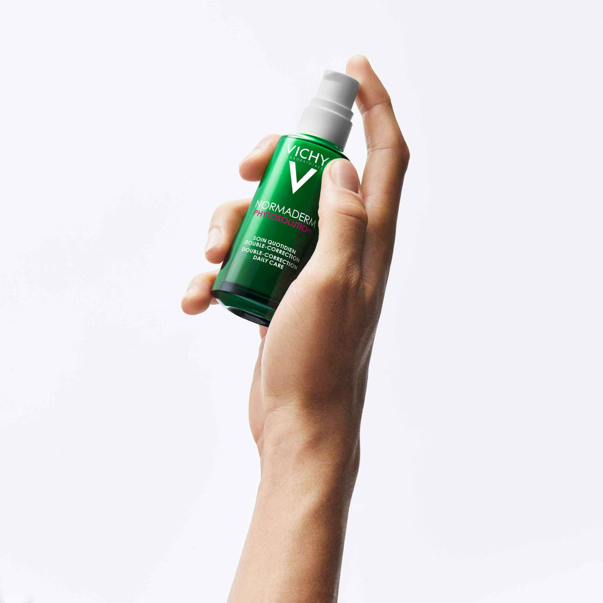 Vichy Normaderm, hand holding the pump bottle