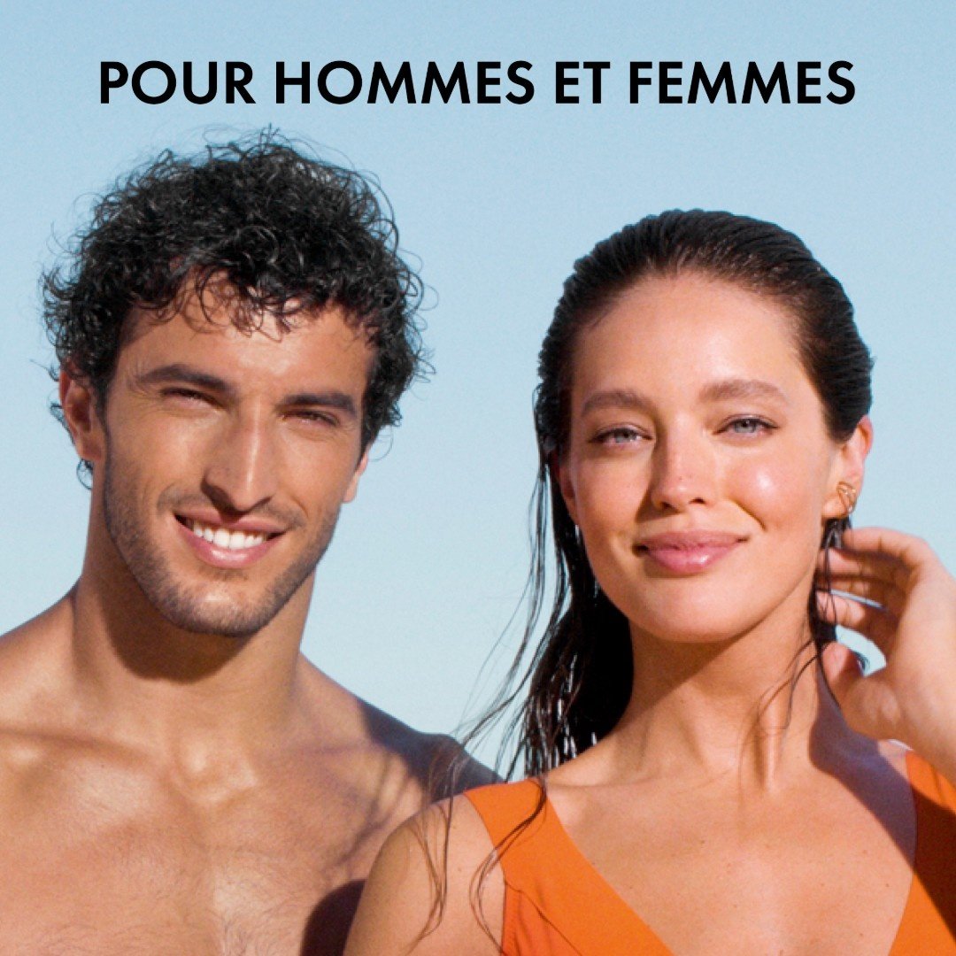Vichy UV Aqua, smiling man and woman under a blue sky